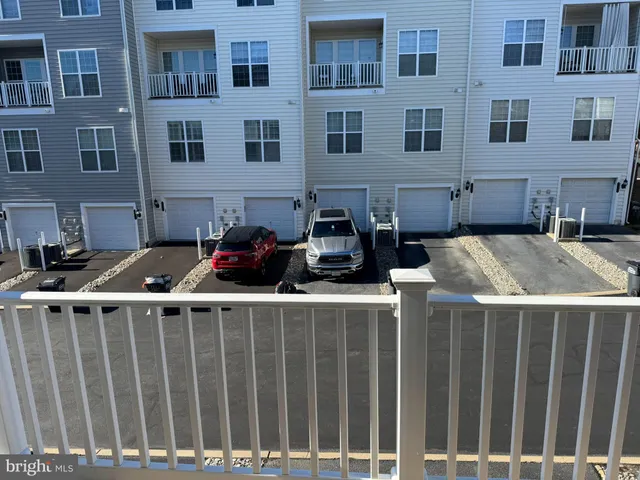 a view of a deck with wooden floor and fence