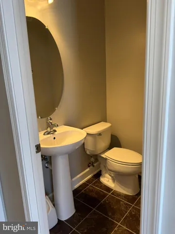 a kitchen with granite countertop a stove and a microwave