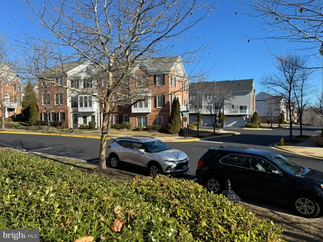 a car parked in front of a brick building