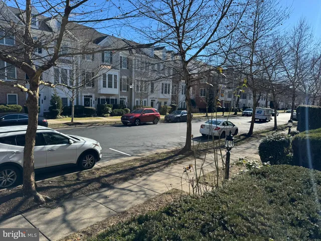 a view of street with parked cars