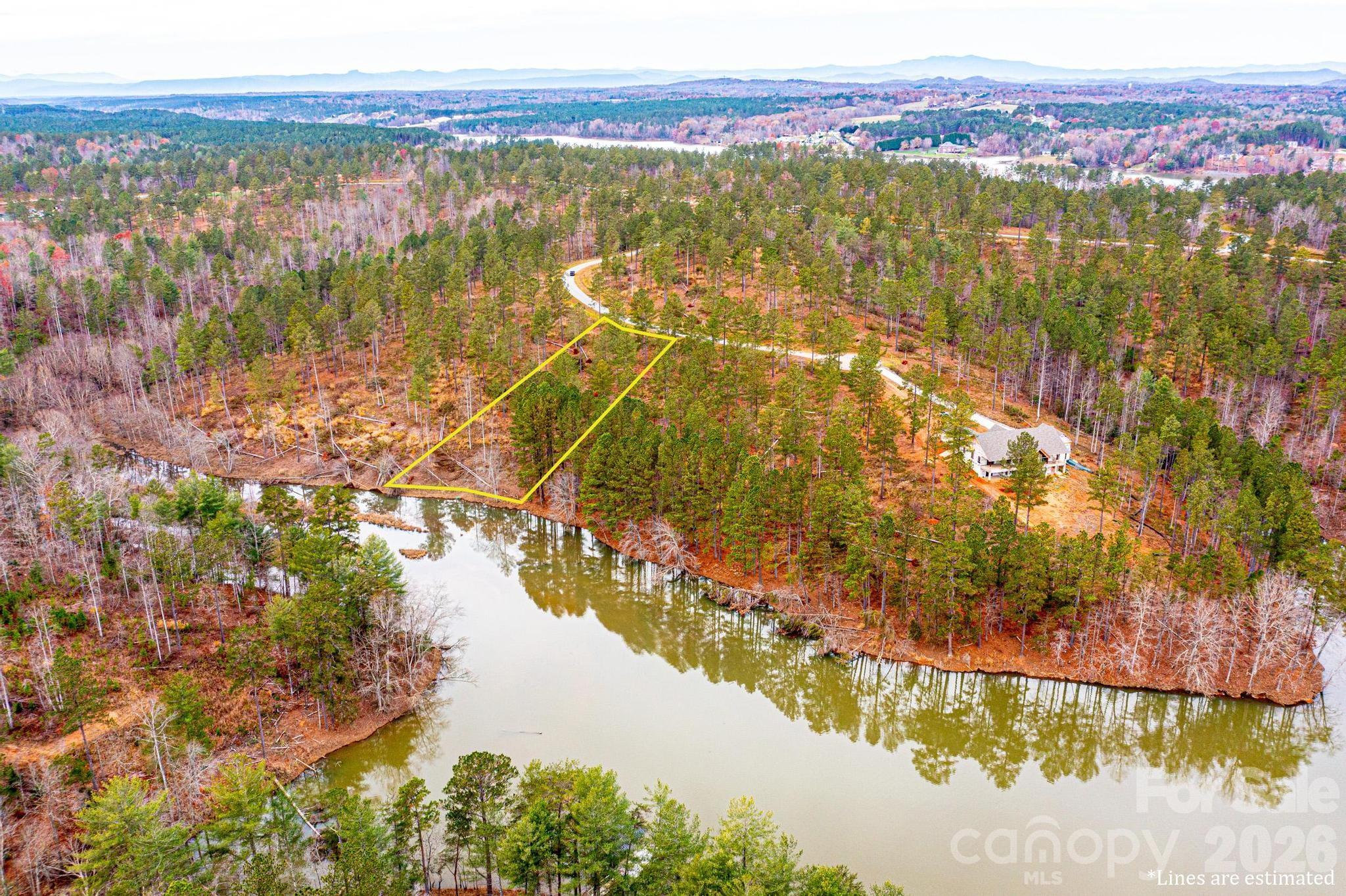 2188 Snowmass Drive Connelly Springs, NC 28612 - Photo 2 of 17 a view of lake and mountain