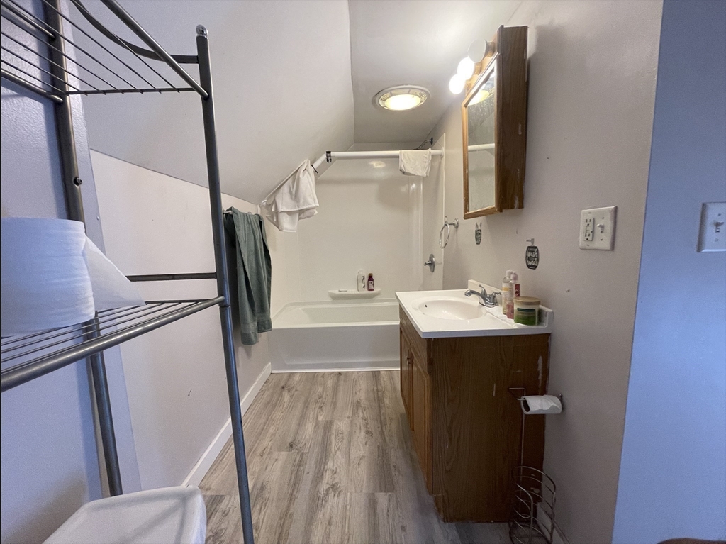 76 Aspen Street Ware, MA 01082 - Photo 19 of 25 a bathroom with a sink mirror and vanity