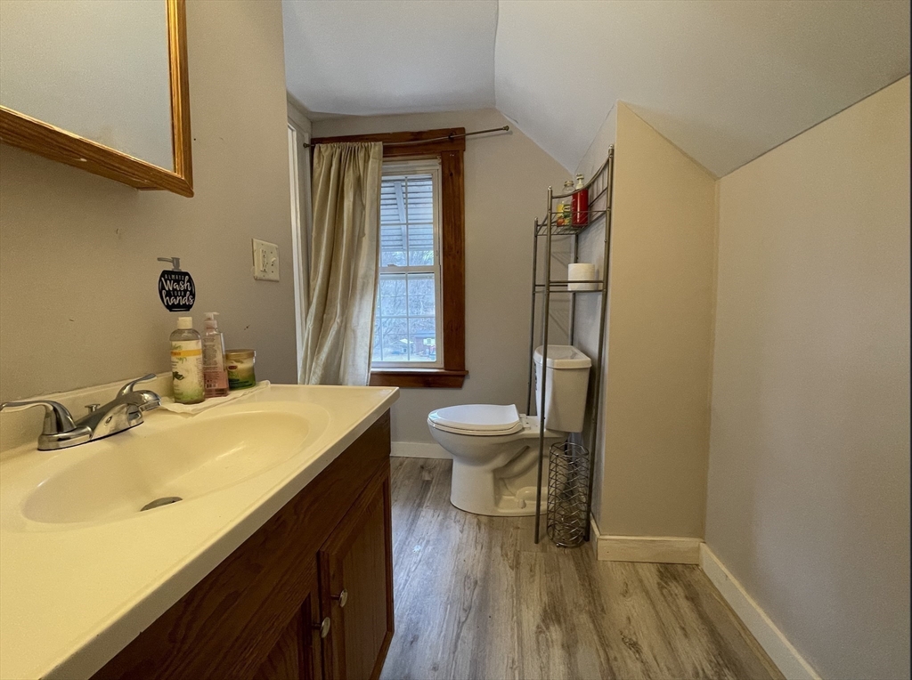 76 Aspen Street Ware, MA 01082 - Photo 20 of 25 a bathroom with a sink a toilet and a mirror
