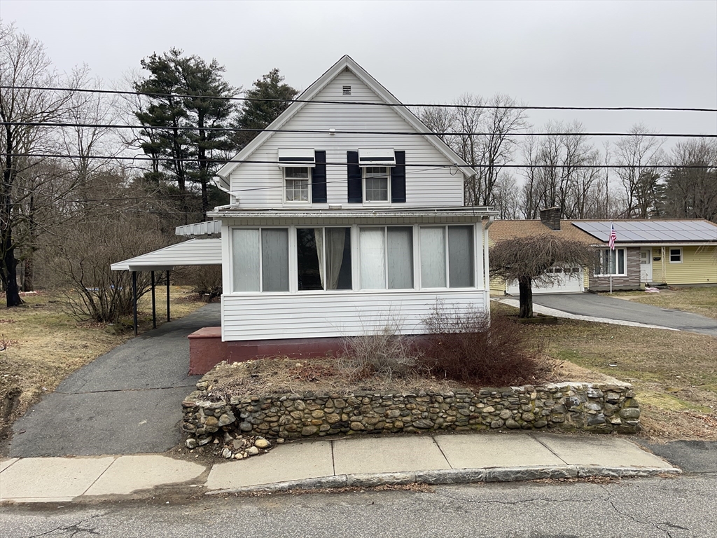 76 Aspen Street Ware, MA 01082 - Photo 2 of 25 a front view of a house with a yard