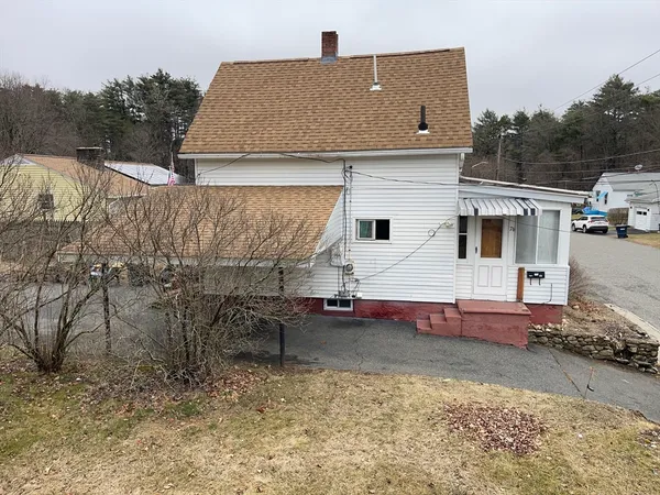 a aerial view of a house with a yard