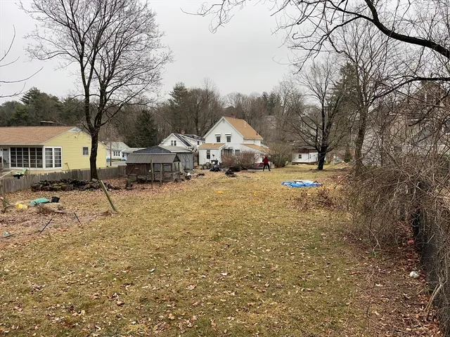 a view of a town with large trees