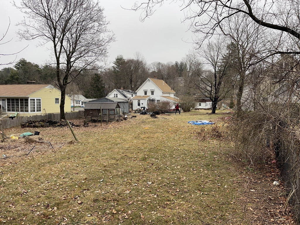 76 Aspen Street Ware, MA 01082 - Photo 6 of 25 a view of a town with large trees