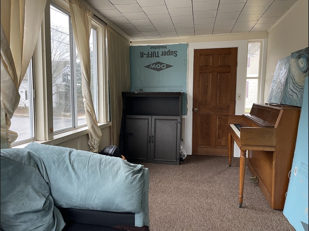 76 Aspen Street Ware, MA 01082 - Photo 10 of 25 a living room with furniture and a window