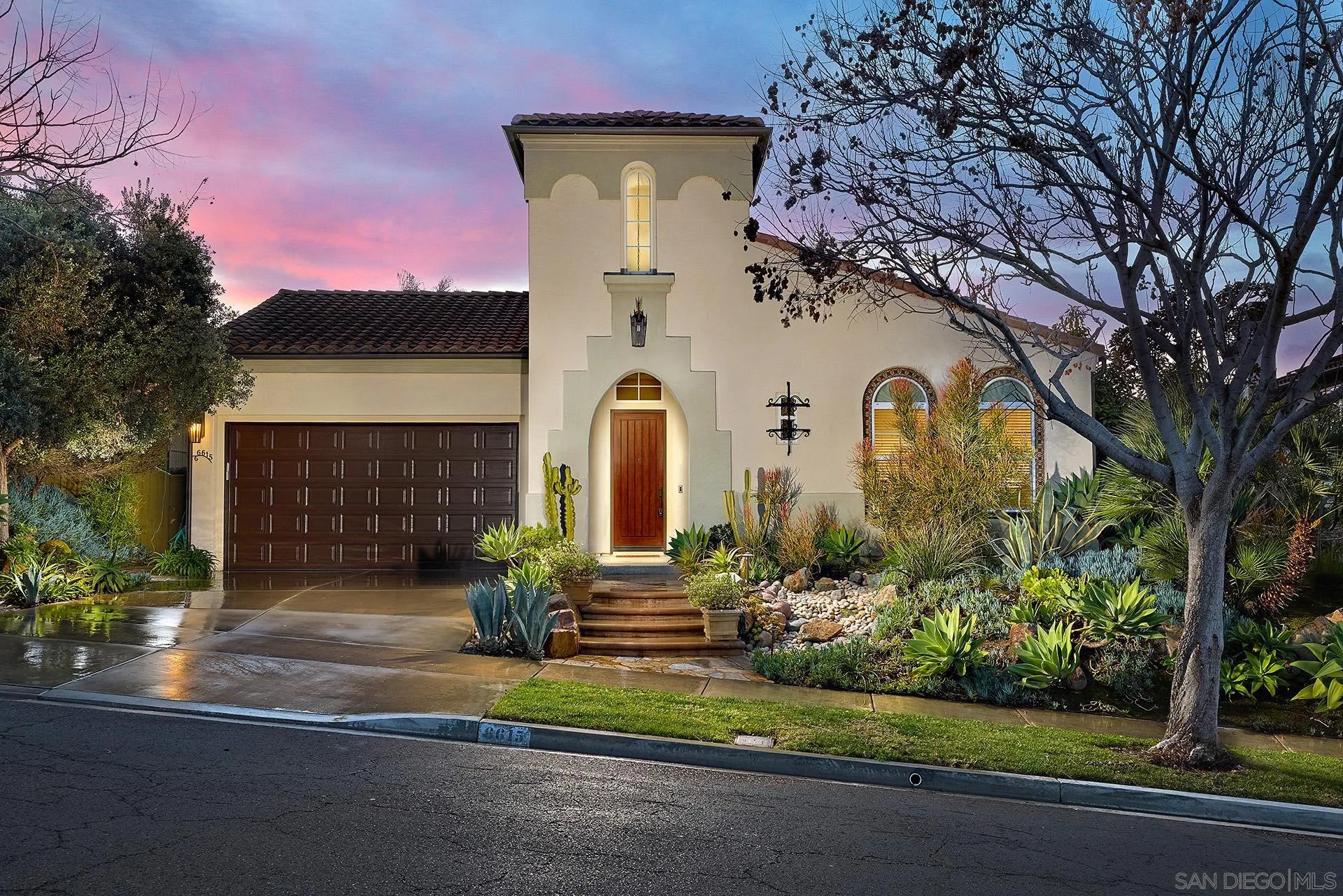 6615 Halite Place Carlsbad, CA 92009 - Photo 1 of 56 a front view of a house with garden