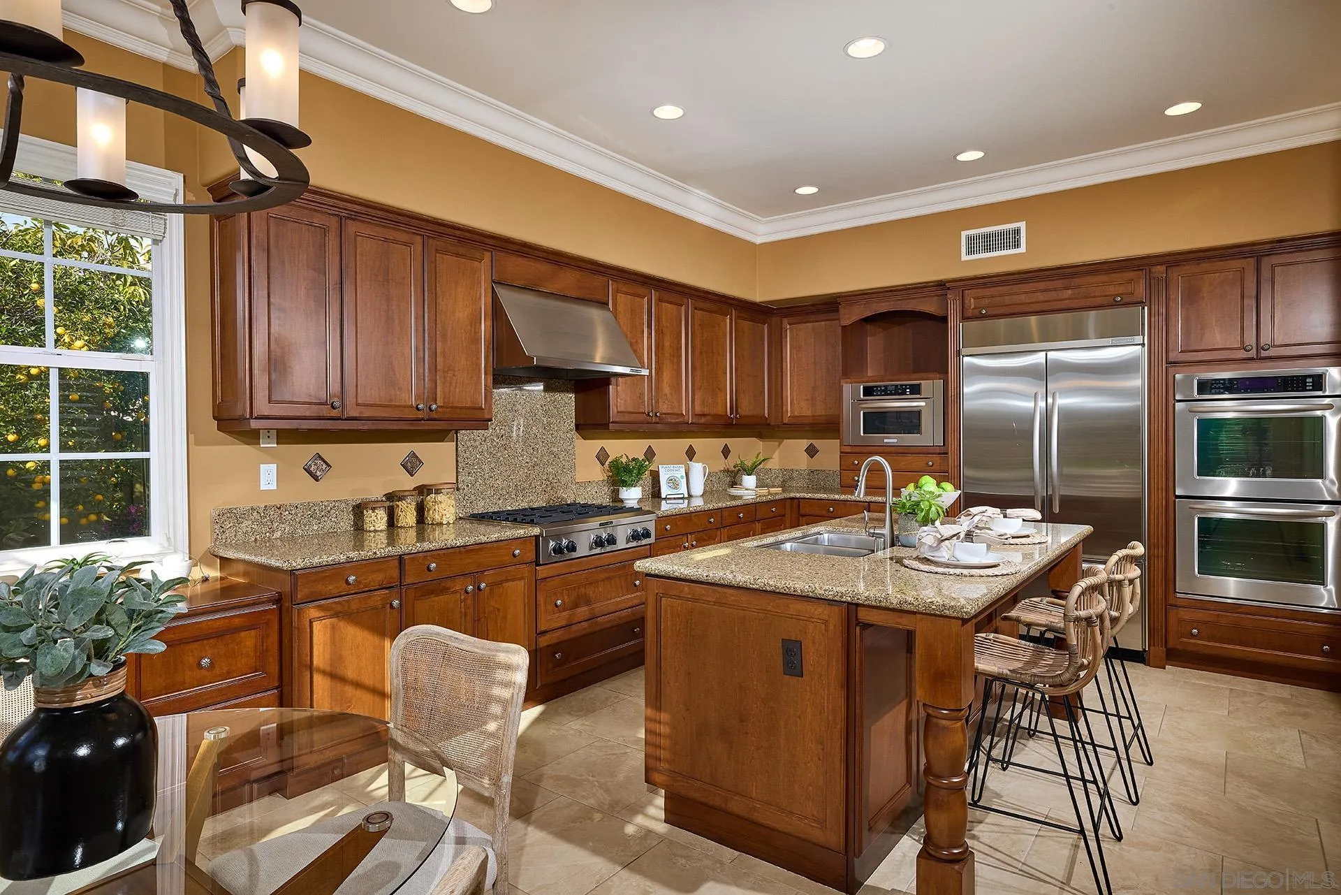 6615 Halite Place Carlsbad, CA 92009 - Photo 12 of 56 a kitchen with granite countertop lots of counter top space and stainless steel appliances