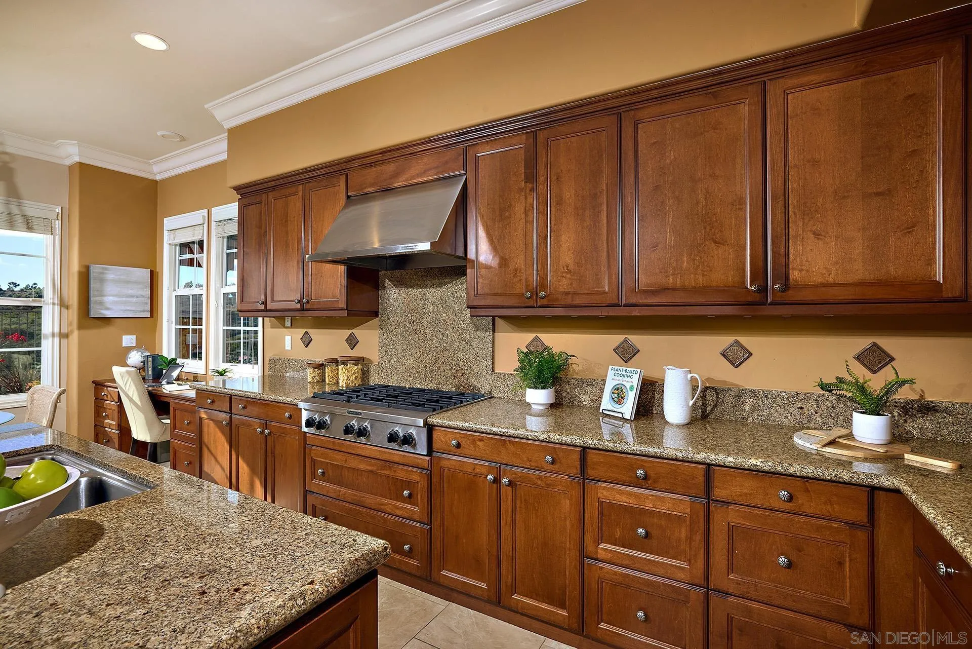 6615 Halite Place Carlsbad, CA 92009 - Photo 13 of 56 a kitchen with stainless steel appliances granite countertop a stove a sink dishwasher and cabinets with wooden floor