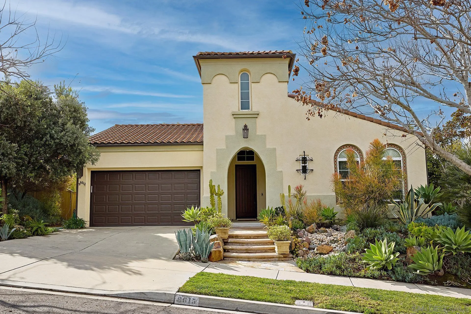 6615 Halite Place Carlsbad, CA 92009 - Photo 2 of 56 a front view of a house with garden