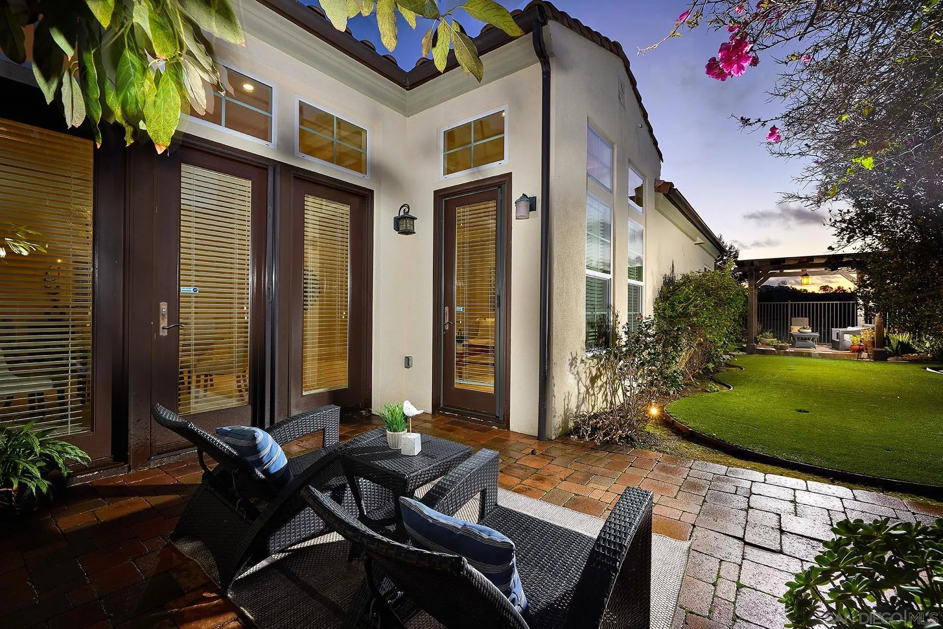 6615 Halite Place Carlsbad, CA 92009 - Photo 24 of 56 a view of a patio with table and chairs and potted plants