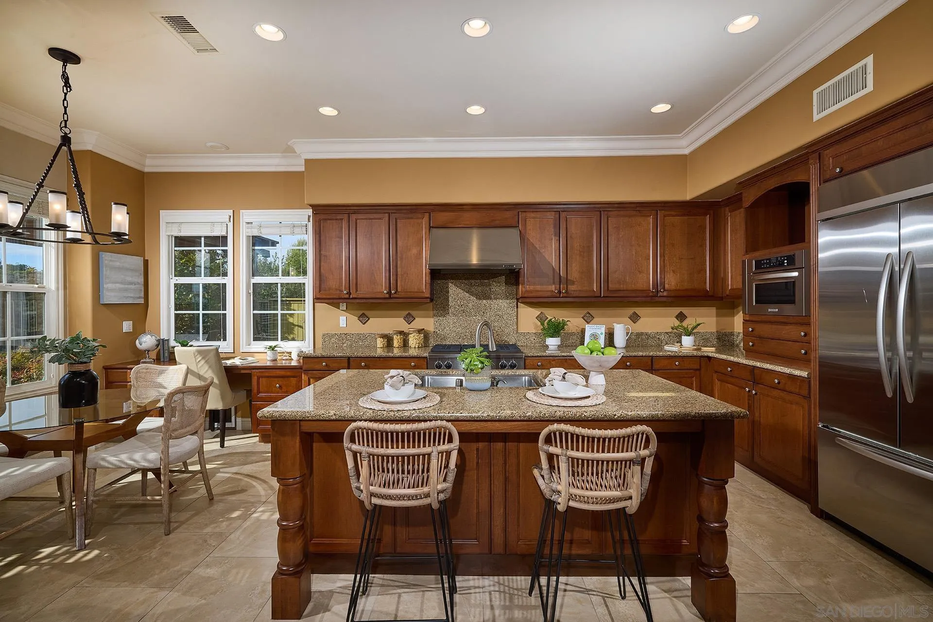 6615 Halite Place Carlsbad, CA 92009 - Photo 10 of 56 a kitchen with granite countertop lots of counter top space and stainless steel appliances
