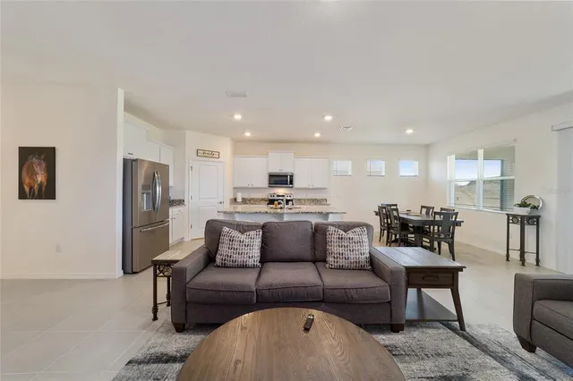 a living room with fireplace furniture and a flat screen tv