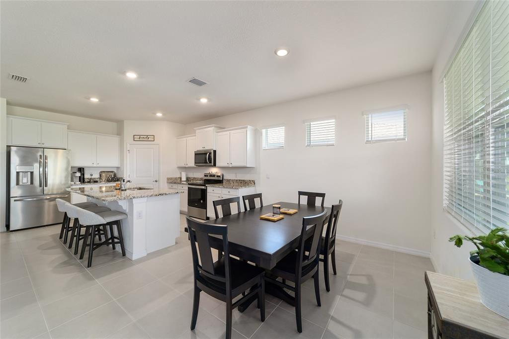 5252 Northwest 46th Lane Road Ocala, FL 34482 - Photo 25 of 51 a view of a dining room with furniture