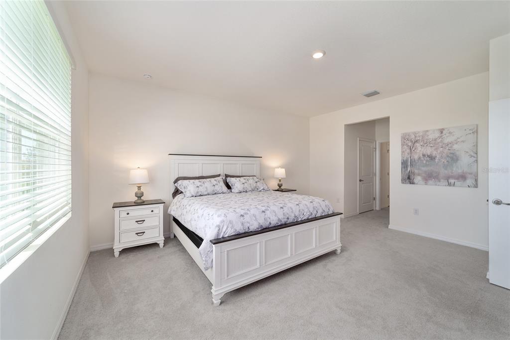 5252 Northwest 46th Lane Road Ocala, FL 34482 - Photo 28 of 51 a bedroom with a large bed and a window