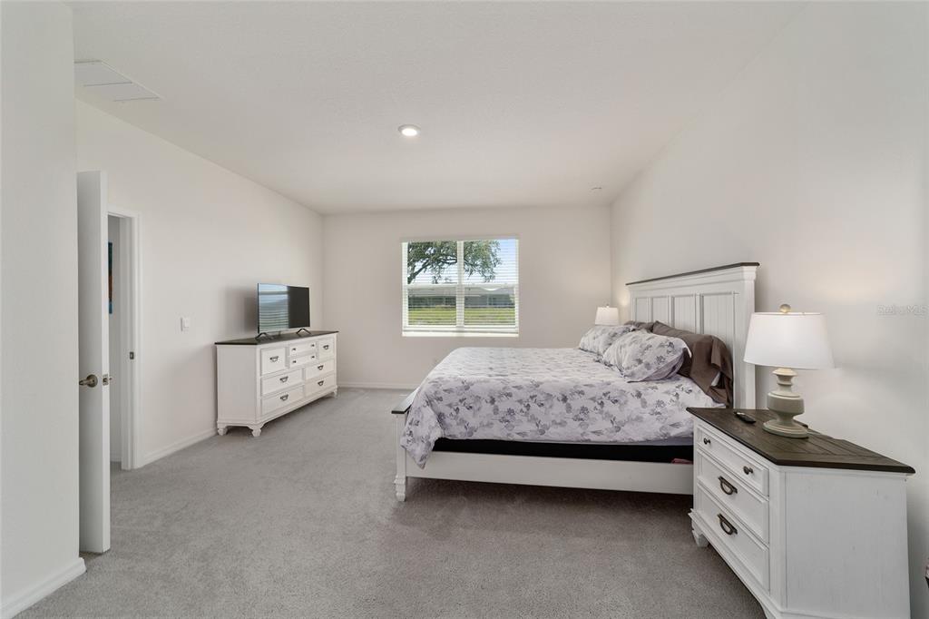 5252 Northwest 46th Lane Road Ocala, FL 34482 - Photo 30 of 51 a bedroom with a bed and a window