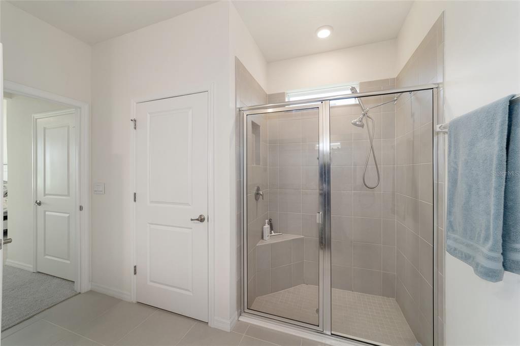 5252 Northwest 46th Lane Road Ocala, FL 34482 - Photo 33 of 51 a bathroom with a glass shower door