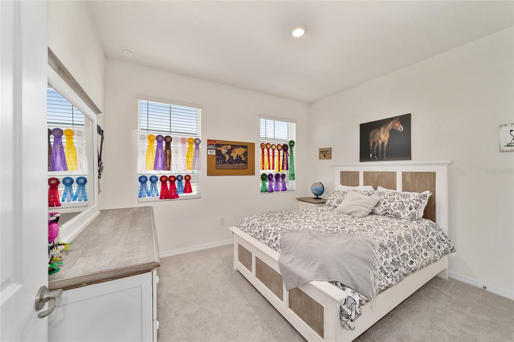 5252 Northwest 46th Lane Road Ocala, FL 34482 - Photo 34 of 51 a bedroom with a bed and dresser