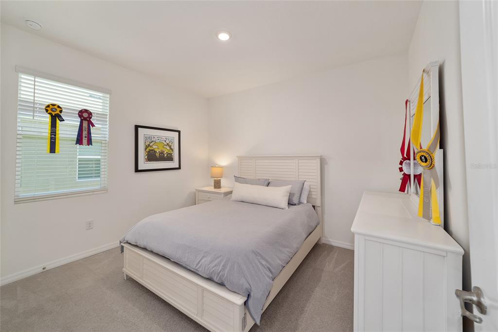 5252 Northwest 46th Lane Road Ocala, FL 34482 - Photo 38 of 51 a bedroom with a bed and a desk