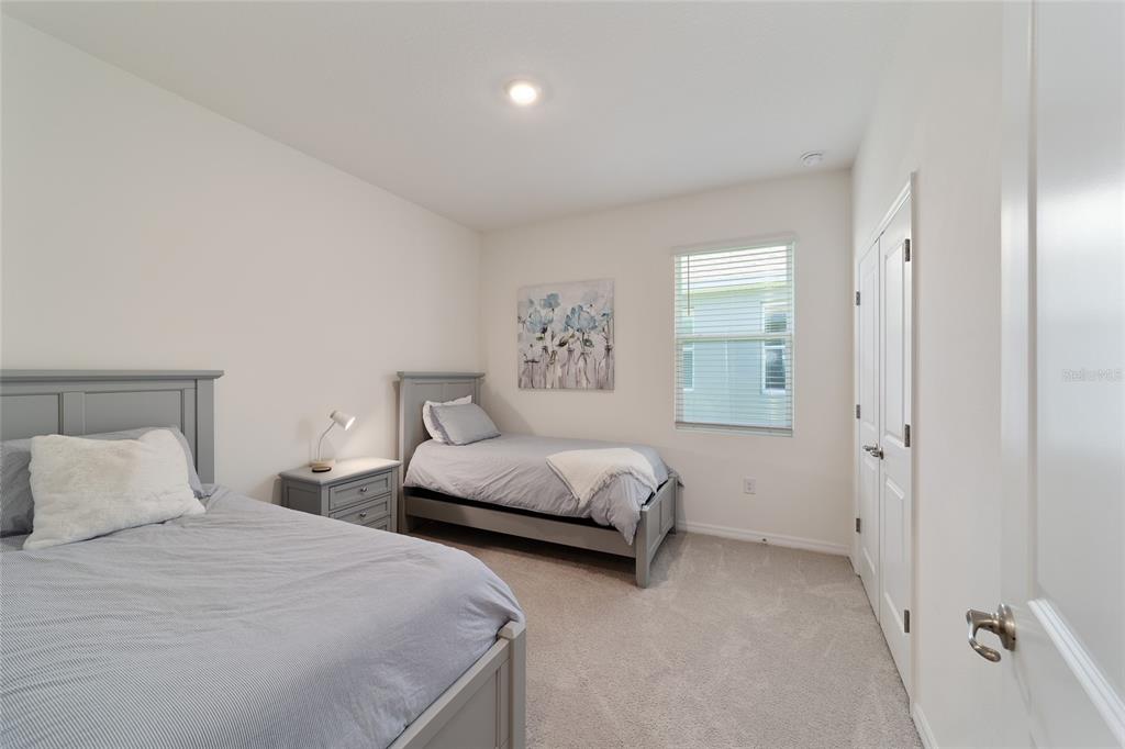 5252 Northwest 46th Lane Road Ocala, FL 34482 - Photo 40 of 51 a bedroom with two beds and a window