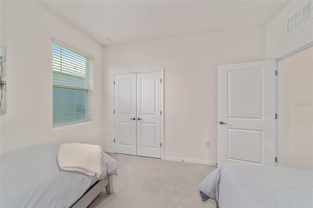 5252 Northwest 46th Lane Road Ocala, FL 34482 - Photo 41 of 51 a bedroom with a bed and a window