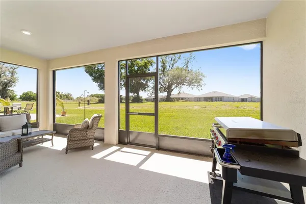 a balcony with chairs and ocean view