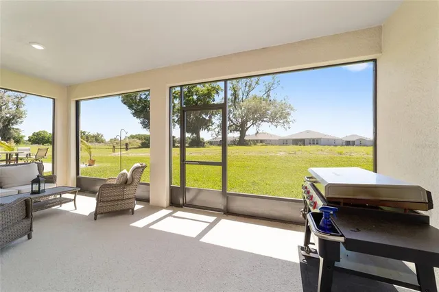 a balcony with chairs and ocean view