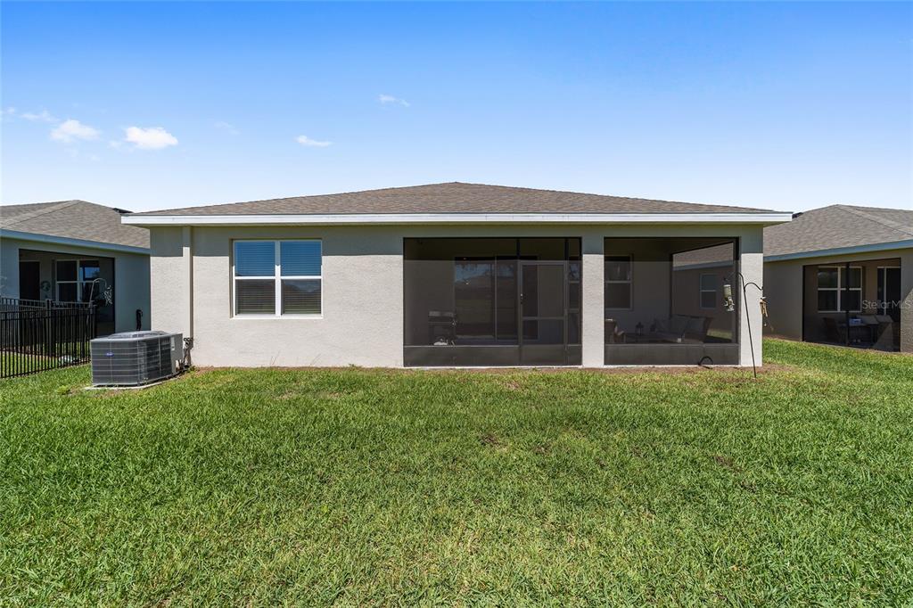 5252 Northwest 46th Lane Road Ocala, FL 34482 - Photo 47 of 51 front view of a house with a yard