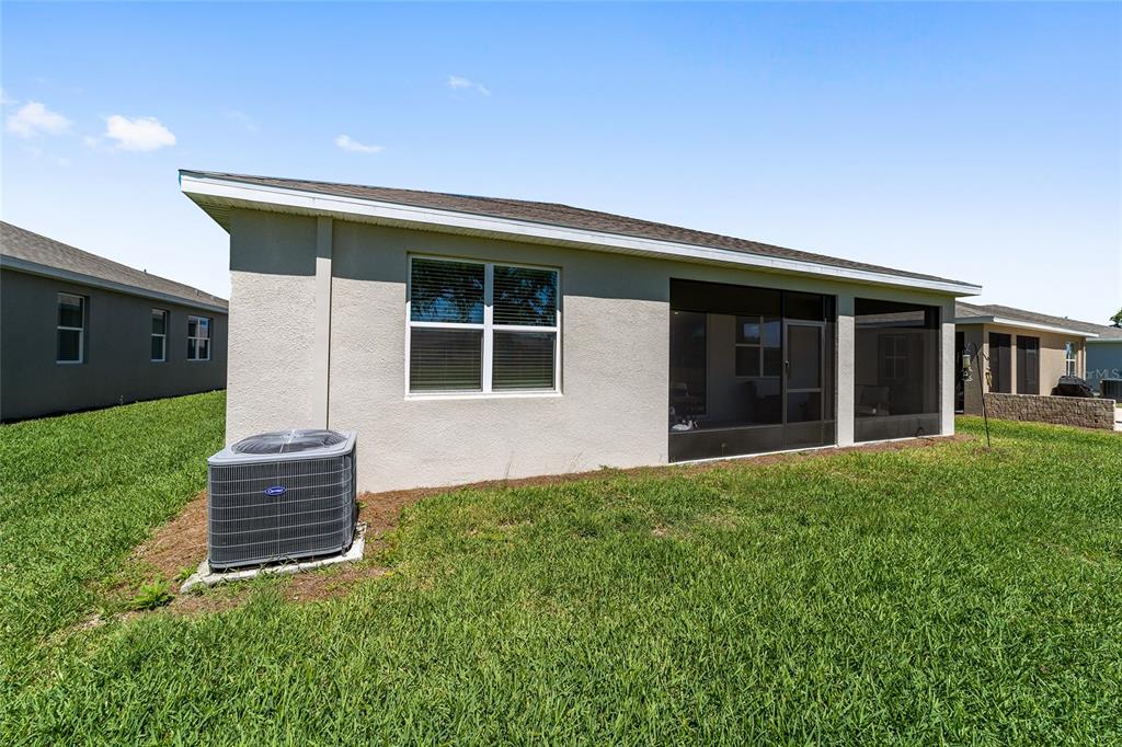 5252 Northwest 46th Lane Road Ocala, FL 34482 - Photo 48 of 51 a front view of a house with a garden