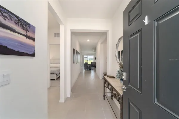a view of a livingroom with furniture and front door