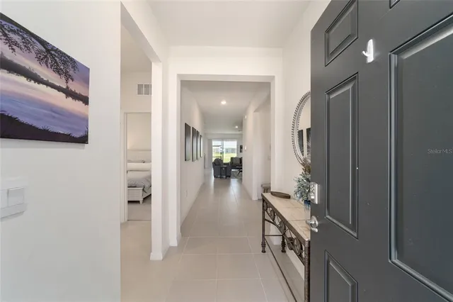 a view of a livingroom with furniture and front door