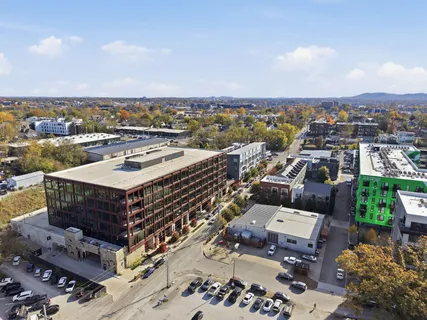 a view of a house with a yard and garage