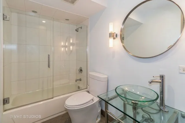 a kitchen with granite countertop a stove microwave and sink
