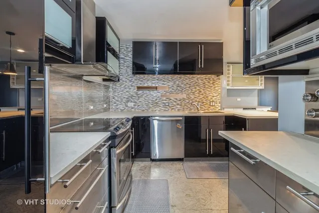 a kitchen with a sink and a microwave