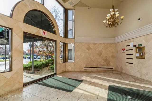 a view of a fireplace with a potted plant and a large window