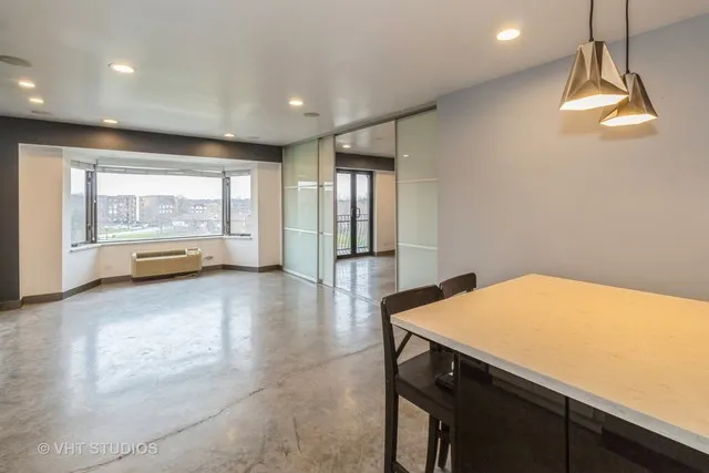a view of empty room with floor to ceiling window