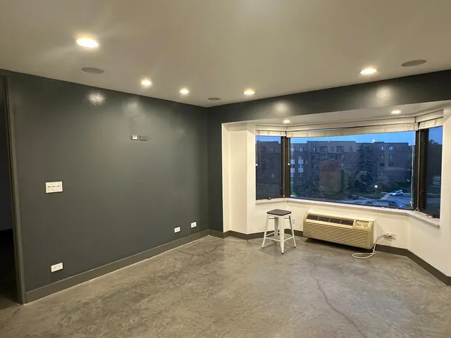 a view of an empty room with a window