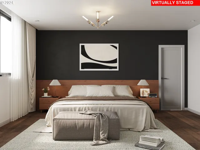 a bedroom with a bed and a painting on the wall