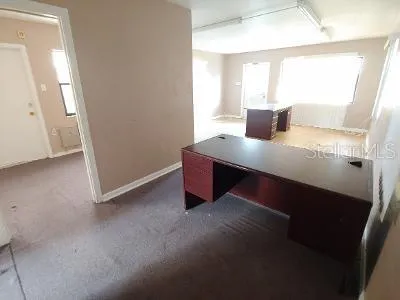 an empty room with windows