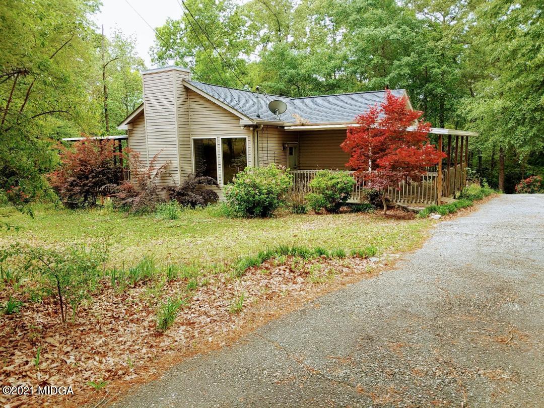 7531 Goodall Mill Road Macon, GA 31216 - Photo 1 of 16 a front view of house with yard and green space