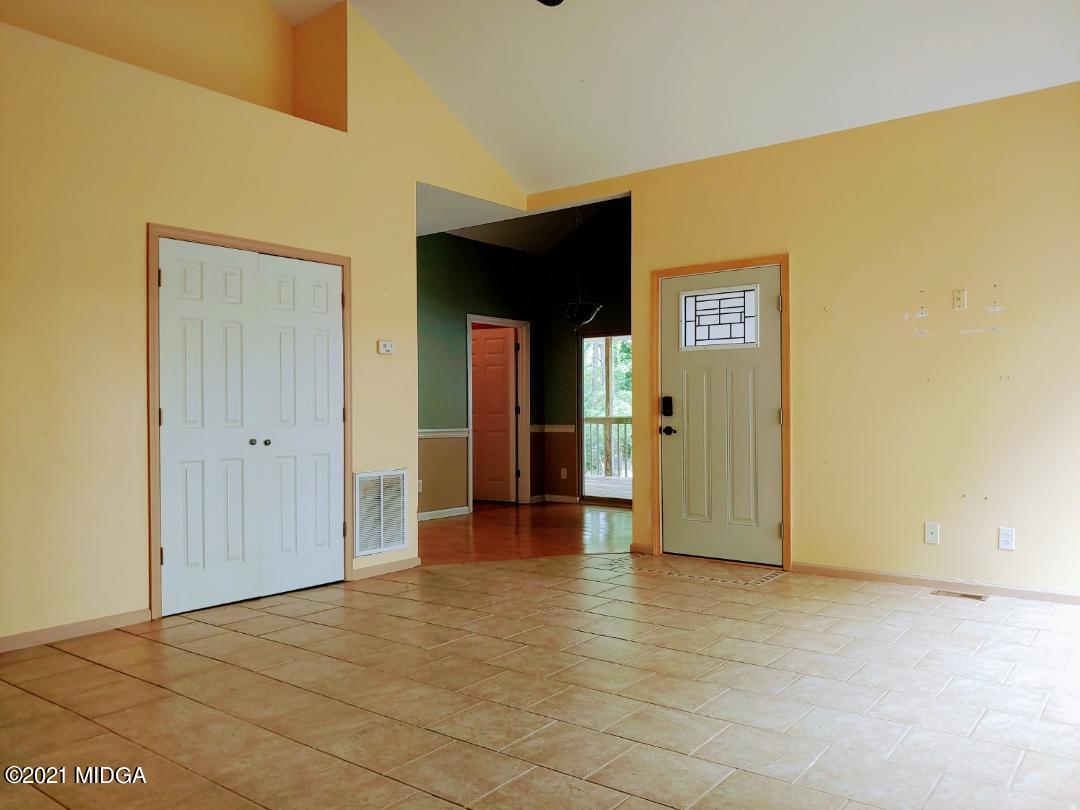 7531 Goodall Mill Road Macon, GA 31216 - Photo 5 of 16 a view of a hallway with wooden floor