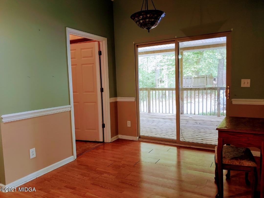 7531 Goodall Mill Road Macon, GA 31216 - Photo 8 of 16 a view of livingroom with furniture wooden floor and window