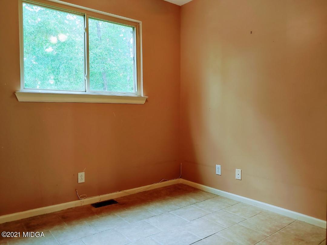 7531 Goodall Mill Road Macon, GA 31216 - Photo 10 of 16 an empty room with a window
