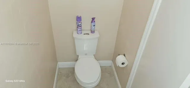 a close view of a toilet in a bathroom