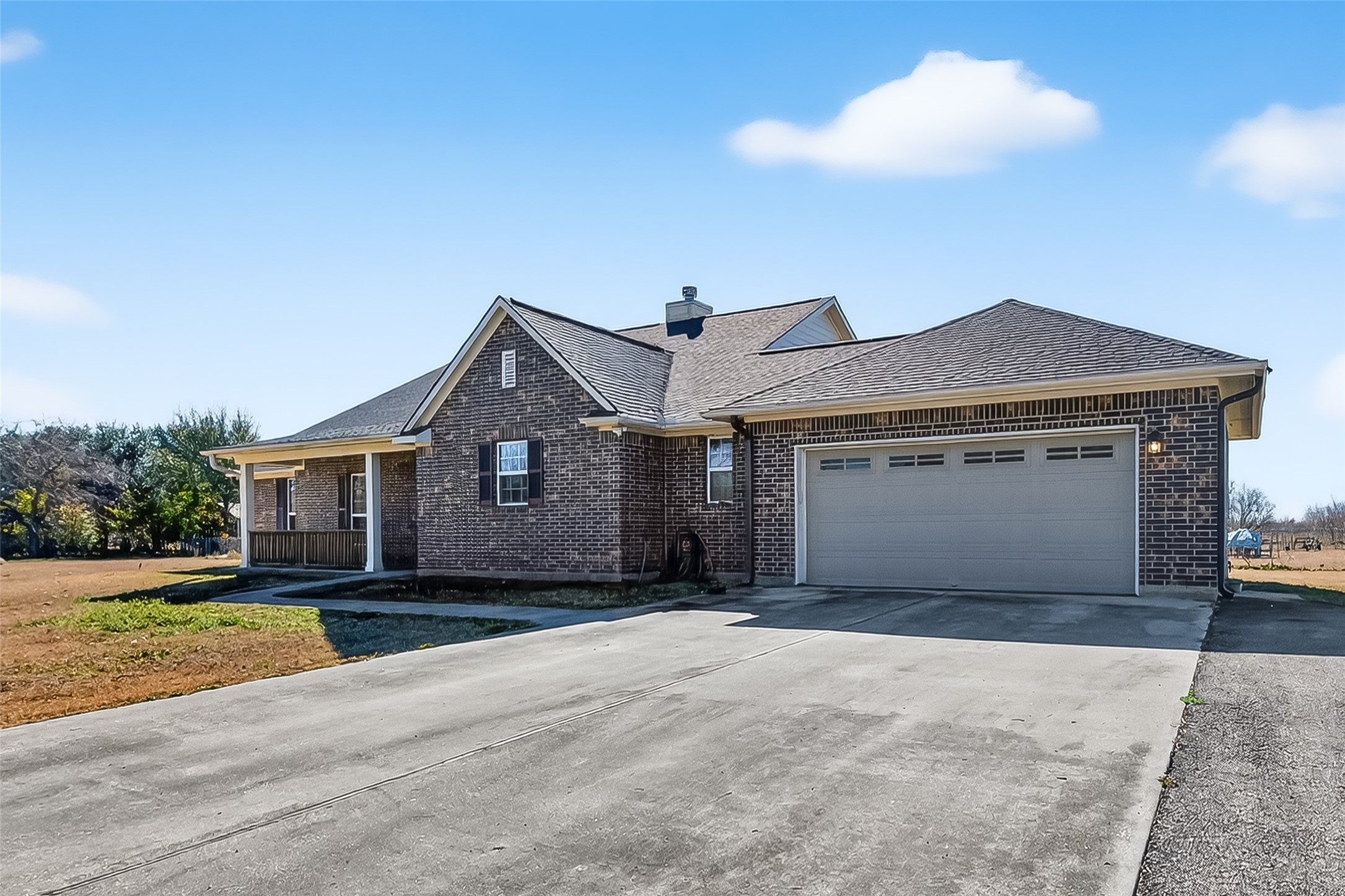 3418 Barbers Hill Road Highlands, TX 77562 - Photo 4 of 50 a front view of a house with a yard and garage