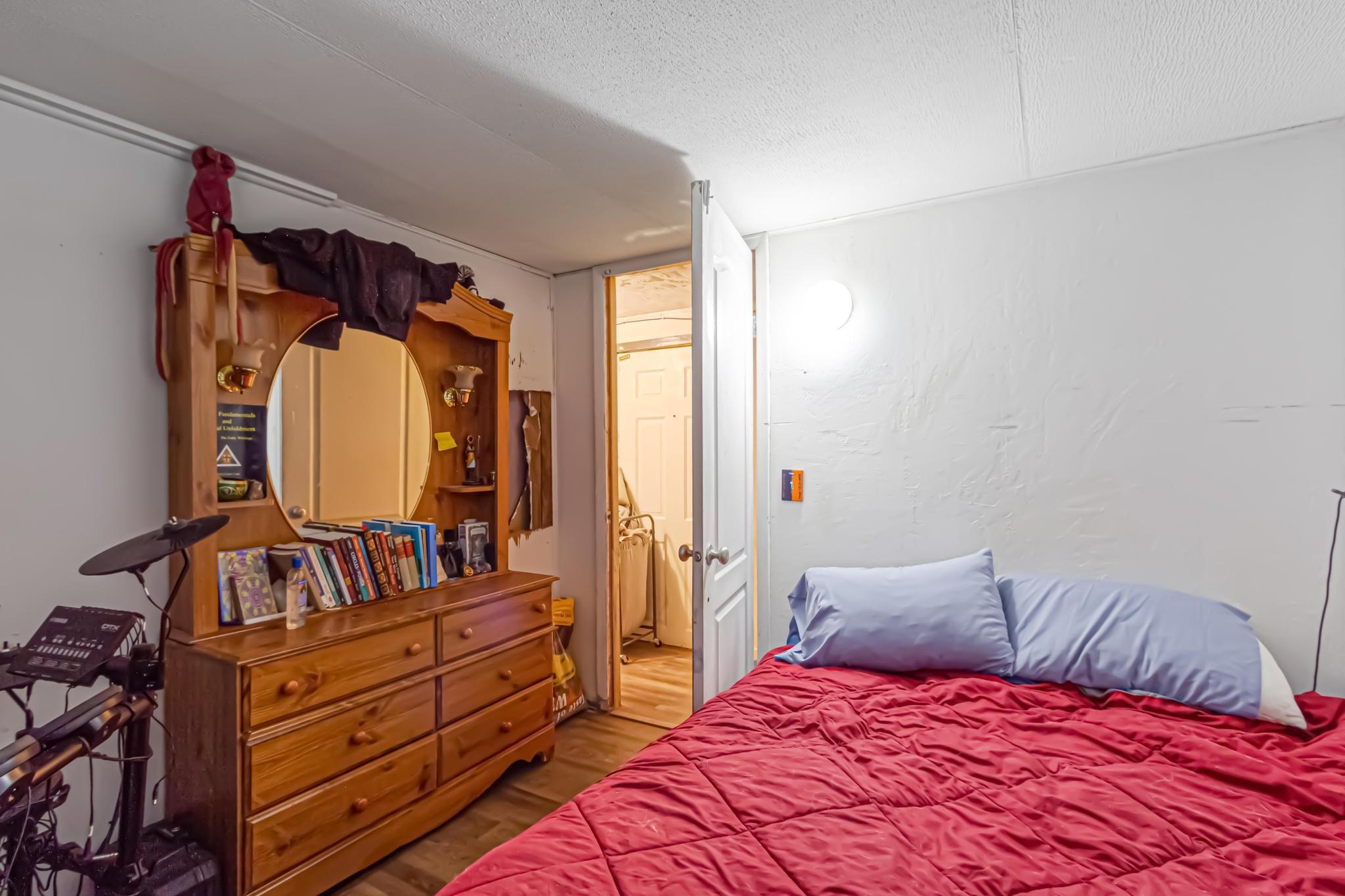 3268 E Road, Unit 1 Clifton, CO 81520 - Photo 16 of 17 a bedroom with a large bed and a window