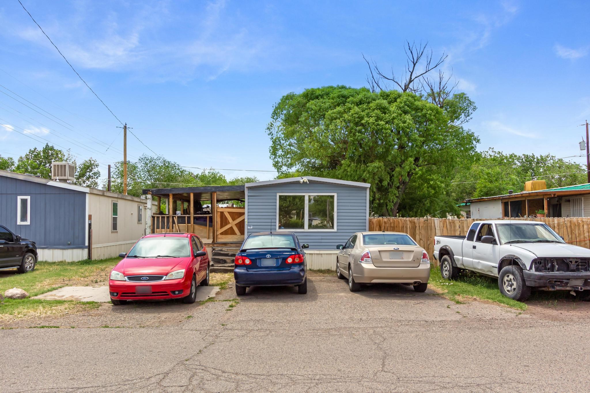 3268 E Road, Unit 1 Clifton, CO 81520 - Photo 2 of 17 a cars parked in front of a house