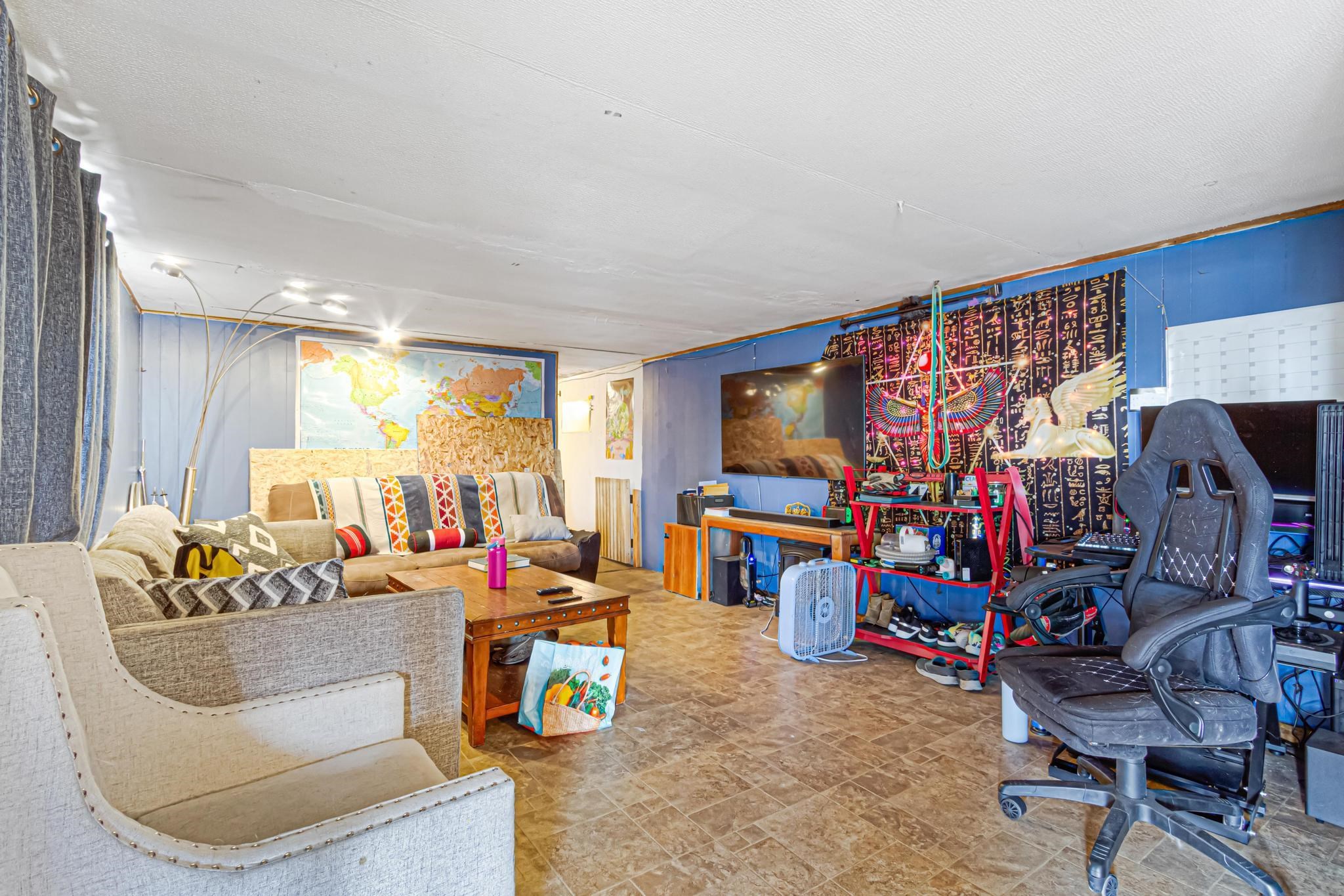 3268 E Road, Unit 1 Clifton, CO 81520 - Photo 7 of 17 a living room with furniture and a flat screen tv